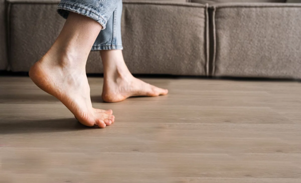 Bare feet walking on wood floors